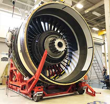 Dedienne Aerospace GE9X engine stand in a workshop