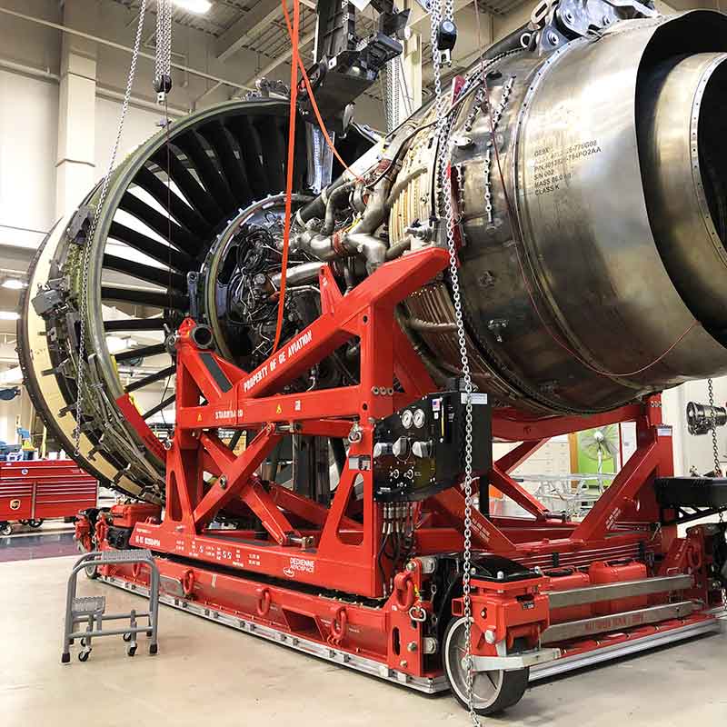Dedienne Aerospace GE9X engine stand in a workshop