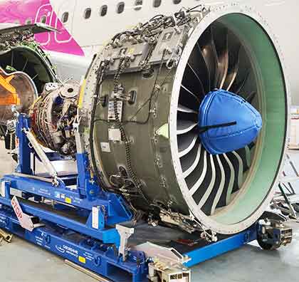 Dedienne Aerospace PW1100 engine stand in a workshop
