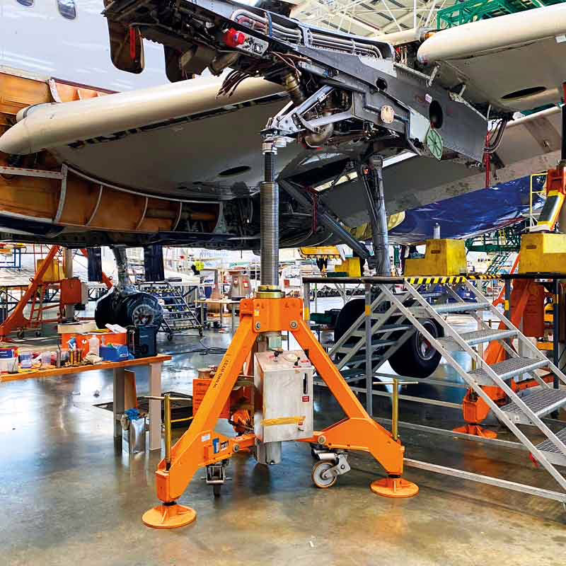 wing A320 tripod jack in a MRO workshop